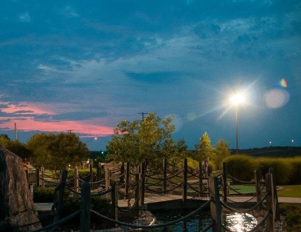 Adventure Cove course lights at sunset